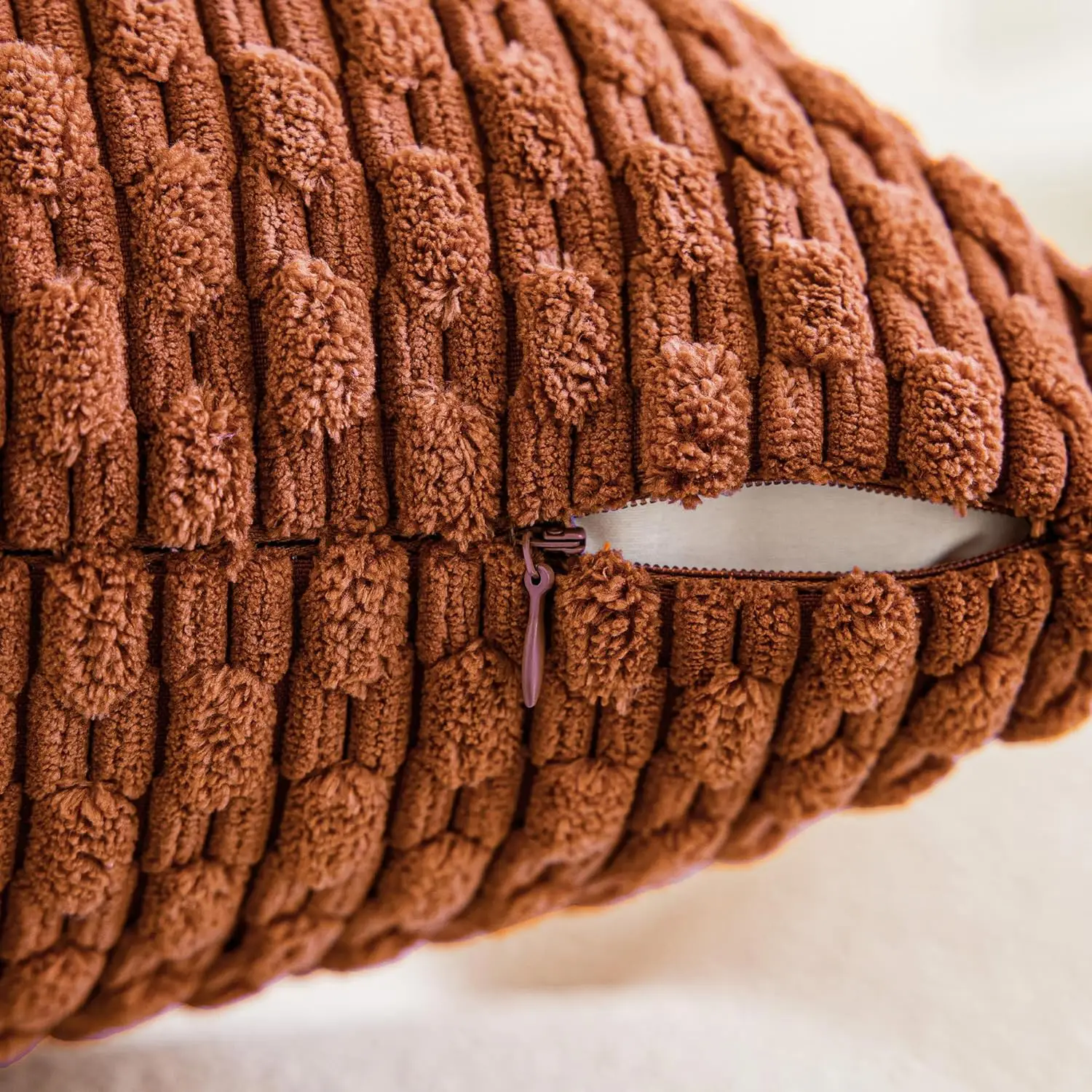 Close-up of the textured corduroy cushion cover with a detailed view of the practical zippered closure.