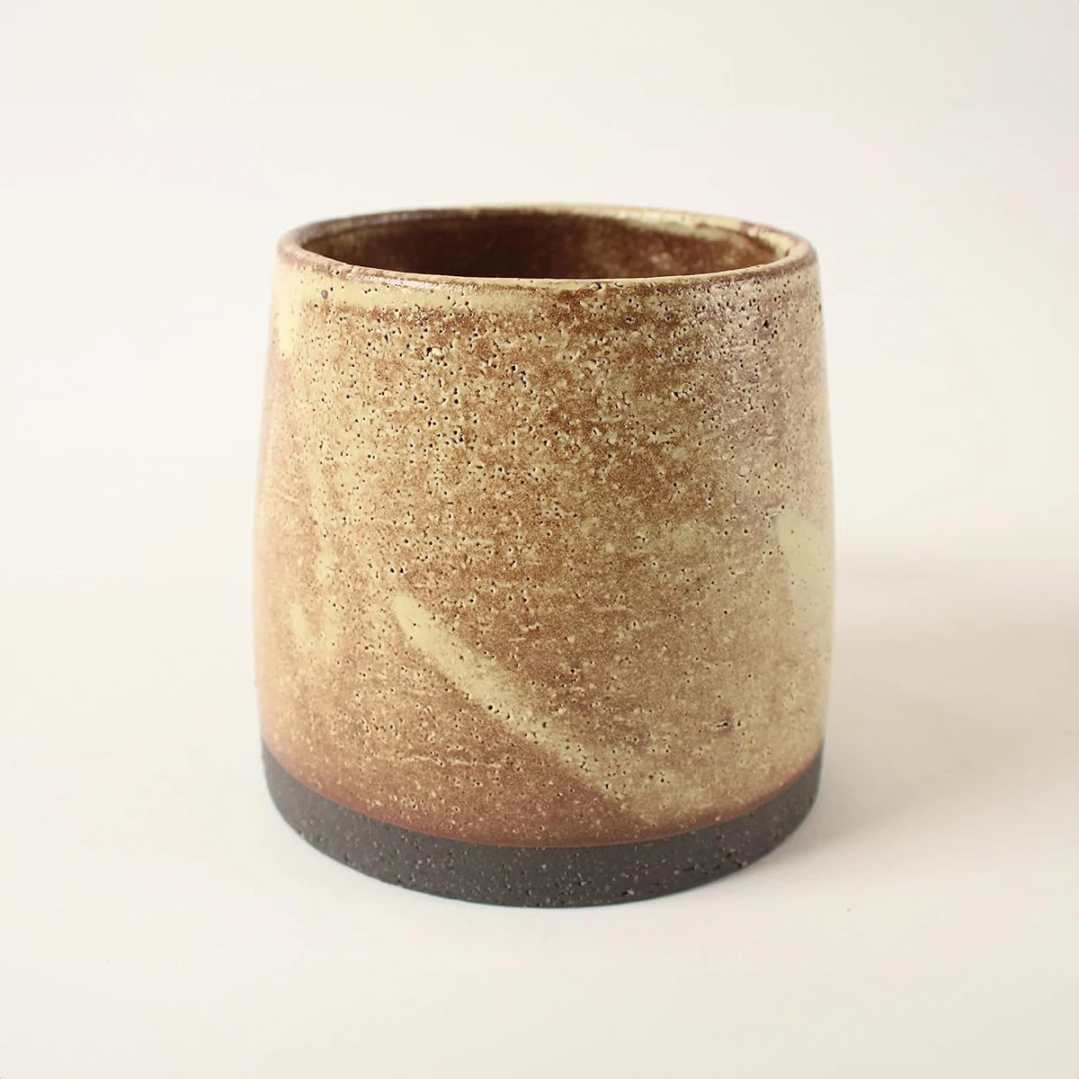 Artisanal Japanese Mino ware mug with a rich history, featuring a distinctive peanut brown & ocher glaze, unique to the Mino region.