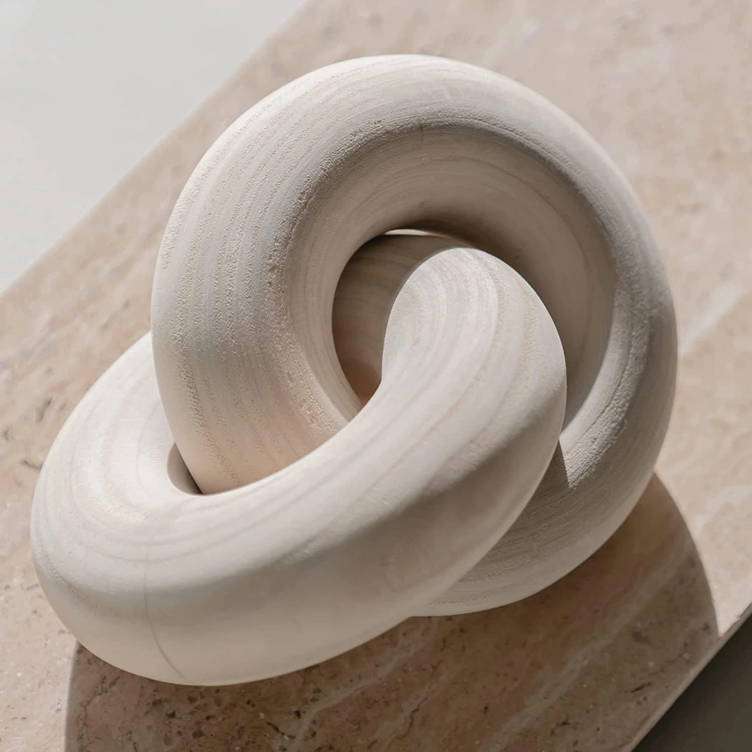 Close-up of the unique grain and texture of a hand-carved wooden knot, showcasing its natural elegance.